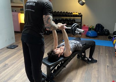 Steve spotting Mehmet with a tricep skull crusher