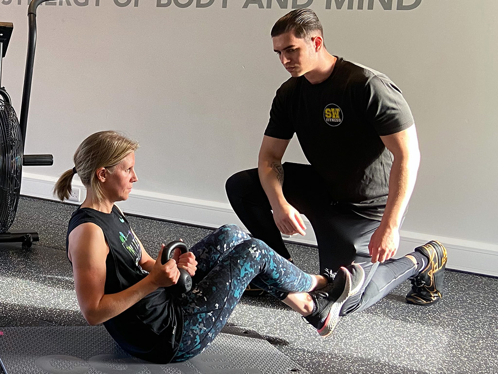 Personal Trainer with client at the gym studio in Tarporley, Cheshire.
